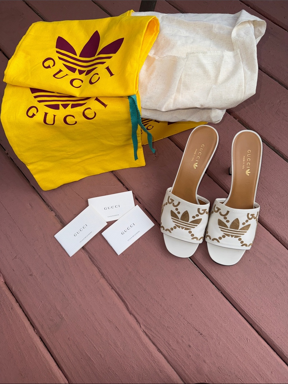 Gucci Cream Leather Slide Mules with Gold Logo Pattern - Picture 1 of 16